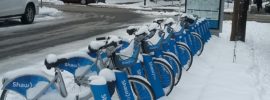 Walking past the blue public rental bicycles on a Monday in Vancouver and they are covered in freshly fallen west coast snow