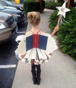 Little girl dressed as a book full of stories to be told